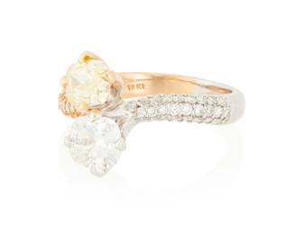 44
An 18K Bi-Color Gold, Fancy Yellow Diamond and Diamond Ring
Of a bypass design featuring a 0.83 carat cushion modified brilliant-cut Fancy Yellow diamond and a 1.02 carat cushion brilliant-cut diamond accented by round diamonds all set in a bi-color gold shank

Size: 6 1/2
5.0 grams gross

Accompanied by a GIA Report numbered #2141417729, dated February 6, 2012, stating the diamond as Natural with a color grade of Fancy Yellow and a clarity grade of VS2, no fluorescence.

Accompanied by a GIA Report numbered #2161024131, dated May 20, 2014, stating the diamond as Natural with a color grade of H and a clarity grade of VS2, no fluorescence.
Estimate: $4,000 - $6,000