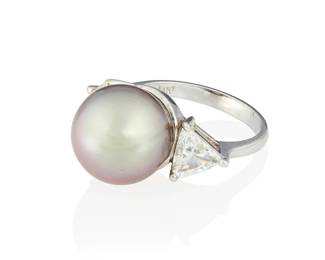 150
An 18K White Gold, Colored Cultured Pearl and Diamond Ring
Centering a gray cultured pearl measuring approximately 12.40 mm, flanked by two trilliant diamonds weighing approximately 1.22 carats

Size: 6
6.1 grams gross
Estimate: $1,500 - $2,000
