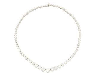 208
A Platinum and Diamond Riviere Necklace
Featuring graduated round diamonds weighing approximately 16.34 carats

Length: 15 1/2 in.
29.0 grams gross
Estimate: $25,000 - $35,000
