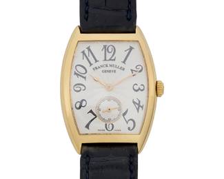 293
Franck Mueller: An 18K Gold Watch
Dial: 22.88 mm, with Arabic hour markers and one subsidiary dial
Model: casablanca
Case: 30.00 mm
Case number: 7500 s6
Closure: black leather strap and 14k gold buckle clasp
Signed: strap, case and dial, with original box

Inner circumference: 6 1/2 - 8 1/2 in.
46.9 grams gross
Estimate: $3,000 - $5,000