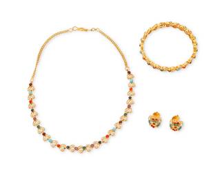 229
A 22K Gold and Gem-Set Suite
Featuring a scalloped link design set with seed pearls, coral, turquoise, sapphires, emeralds, garnets and rubies
3 pieces

Necklace: 16 1/4 in., Bracelet: 6 3/4 in., Earrings: 1/2 in.
47.4 grams gross
Estimate: $4,000 - $6,000
