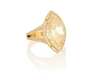 47
An 18K Gold, Yellow Diamond and Diamond Ring
Centering a marquise brilliant-cut diamond weighing 6.29 carats, accented by round diamonds

Size: 6 3/4
8.6 grams gross

Accompanied by a GIA Report numbered #1232599417, dated May 30, 2025, stating the diamond as Natural with a color grade of Yellow and treated clarity.
Estimate: $5,000 - $7,000