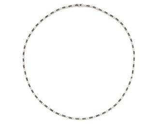 195
An 18K White Gold, Black Diamond and Diamond Necklace
Featuring alternating stations of round black and colorless diamonds weighing approximately 4.30 carats

Length: 17 in.
17.0 grams gross
Estimate: $2,500 - $3,500