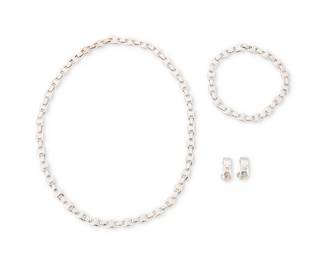 31
Hermès: An 18K White Gold Suite
Comprising a necklace of anchor-link design, with a matching bracelet, and a pair of "H" earrings, each with French assay marks for gold, two signed Hermès, no. 88201 & no. 53156

Necklace: 16 5/8 in.; Bracelet: 7 5/8 in.; Earrings: 5/8 in.
81.3 grams
Estimate: $3,000 - $5,000
