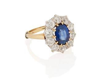 257
Attributed to J.E.Caldwell: A Platinum, 14K Gold, Sapphire and Diamond Ring
Centering an oval sapphire weighing approximately 1.92 carats, encircled by old European-cut diamonds weighing approximately 1.50 carats, with original signed box

Size: 7
5.3 grams gross

Accompanied by a GIA Report numbered #2231572778, dated May 07, 2025, stating the Sapphire is natural Corundum of Cambodian origin with no heat enhancements.
Estimate: $3,000 - $5,000