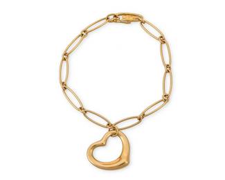 220
Elsa Peretti for Tiffany & Co: An 18K Gold Bracelet
Featuring oval open links suspending a heart-shaped charm, signed Elsa Peretti and Tiffany & Co., Spain

Length: 7 in.
11.2 grams gross
Estimate: $800 - $1,200
