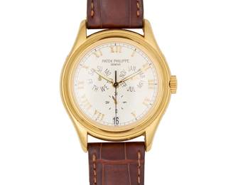 307
Patek Philippe: An 18K Gold 'Annual Calendar' Watch
Dial: 30.00 mm, round with Roamn numerals hour markers and three subsidiary dials
Model: Annual Calendar
Case: 36.00mm
Case number: 3059515, 315/199
Closure: leather strap with 18k gold buckle clasp
Signed: case, dial, strap and clasp, with wood and gold watch tool

Inner circumference: 7 - 8 1/2 in.
75.1 grams gross
Estimate: $10,000 - $15,000
