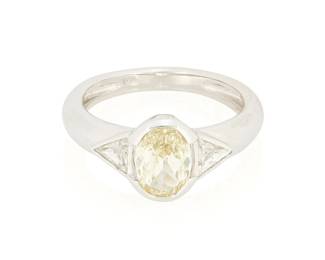 43
An 18K White Gold, Colored Diamond and Diamond Ring
Centering an oval Fancy Yellow diamond weighing 1.51 carats, accented by two triangular-cut diamonds weighing approximately 0.50 carat

Size: 7
5.0 grams gross
Estimate: $3,000 - $5,000
