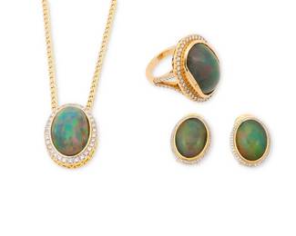 159
A 14K Gold, Opal and Diamond Suite
Including a necklace pair of earrings and ring all centering oval opal cabochons encircled by round diamonds weighing approximately 1.85 carats total
3 pieces

Necklace: 19 3/4 in., Earrings: 3/4 x 1/2 in., Ring: 7 1/4
29.7 grams gross
Estimate: $4,000 - $6,000