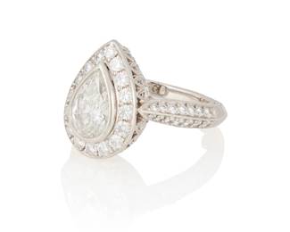 244
Jack Kelége: A Platinum and Diamond Ring
Centering a pear-shaped diamond weighing approximately 1.40 carats, accented by round diamonds and floral engraved details, signed Kelege

Size: 5 1/2 with sizing beads
11.1 grams gross
Estimate: $2,500 - $3,500
