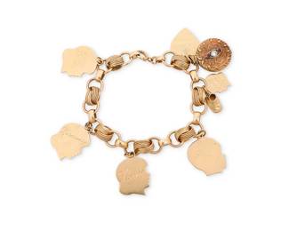 177
A Gold Charm Bracelet
Featuring a fancy link bracelet suspending five 14k gold monogrammed silhouette charms, a 14k gold heart charm and a 10k gold locket featuring rubies and a single diamond

Length: 8 in.
48.7 grams gross
Estimate: $2,000 - $3,000
