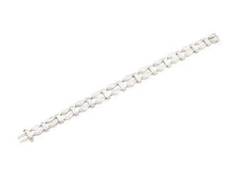 207
A Platinum and Diamond Bracelet
Featuring alternating links of baguette and marquise-shaped diamonds weighing approximately 14.20 carats, c.1950s

Length: 6 1/2 in., Width: 3/8 in.
21.0 grams gross
Estimate: $15,000 - $20,000