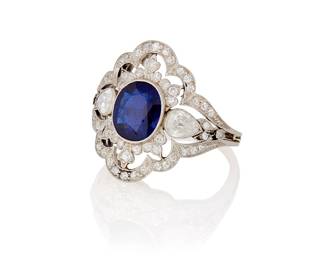 252
A Platinum, Sapphire and Diamond Ring
Centering an oval mixed-cut sapphire weighing approximately 1.60 carats accented by single-cut, old mine-cut and pear-shaped diamonds weighing approximately 1.15 carats all set in an ornate design

Size: 8
5.5 grams gross

Accompanied by a AGL Report numbered #1148781, dated June 23, 2025, stating the Sapphire as natural Corundum of Australian origin with no heat or clarity enhancements.
Estimate: $3,000 - $5,000