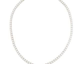 190
An 18K White Gold and Diamond Necklace
Featuring matching size round diamonds weighing approximately 23.30 carats

Length: 18 in.
31.3 grams gross
Estimate: $15,000 - $20,000