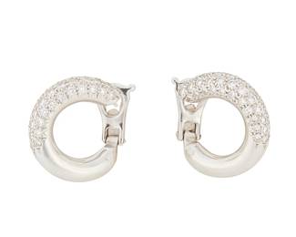 194
Van Cleef & Arpels: A Pair of 18K White Gold and Diamond Earrings
Of a 3/4 profile hoop design accented by round diamonds weighing approximately 1.00 carat, signed VCA, with French assay and makers marks, no. BL12075, c.1980s

Measures: 5/8 x 5/8 in.
10.2 grams gross
Estimate: $10,000 - $15,000