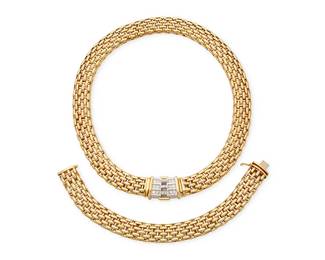 182
Fope: An 18k Bi-Color Gold and Diamond Necklace and Bracelet Set
Of an interlocking brick link design featuring an interchangeable brick link style clasp element accented by round diamonds weighing approximately 0.57 carat, signed Fope with Italian assay marks
3 pieces

Necklace: 17 in., Width: 1/2 in., Bracelet: 8 in., Width: 1/2 in., Clasp: 1 x 5/8 in.
172.7 grams gross
Estimate: $10,000 - $15,000
