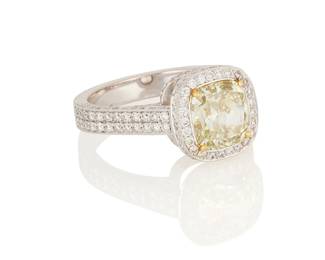 36
An 18K White Gold, Fancy Grayish Greenish Yellow Diamond and Diamond Ring
Centering a cushion modified brilliant-cut Fancy Grayish Greenish Yellow diamond weighing 2.51 carats, accented by round diamonds

Size: 7 1/4
7.3 grams

Accompanied by a GIA Report numbered #1146493706, dated March 15, 2012, stating the diamond as Natural with a color grade of Fancy Grayish Greenish Yellow and a clarity grade of VS1, no fluorescence.
Estimate: $3,000 - $5,000
