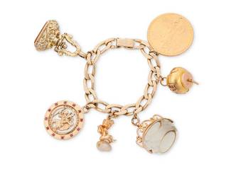 104
A Gold and Gem-Set Charm Bracelet Including Ruser
A 14k gold curb link chain suspending six charms including a 14k gold Ruser angel

Length: 6 1/2 in.
101.6 grams gross
Estimate: $4,500 - $5,500