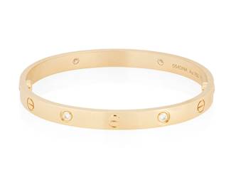 30
Cartier: An 18K Gold and Diamond 'Love' bangle
Featuring four round diamonds weighing approximately 0.40 carat, with two screws, signed Cartier, no. 554DNA, with signed box and papers

Inner circumference: 6 3/4 in., size 18
42.6 grams gross
Estimate: $6,000 - $8,000