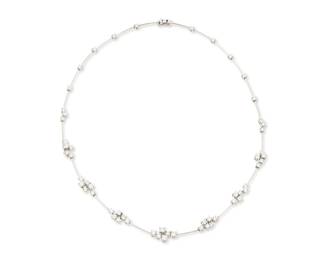 266
A 14K White Gold and Diamond Necklace
Featuring cluster stations of round diamonds weighing approximately 4.05 carats

Length: 16 in.
16.1 grams gross
Estimate: $3,000 - $5,000