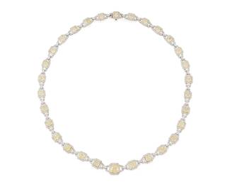 45
A Platinum, 18K Gold, Fancy Yellow Diamond and Diamond Necklace
Centering a radiant-cut Fancy Yellow diamond weighing 2.02 carats, accented by twenty-nine radiant-cut yellow diamonds weighing approximately 13.86 carats, and finished with round diamonds weighing approximately 4.67 carats

Length: 18 in.
75.8 grams gross

Accompanied by a GIA Report numbered #16230914, dated October 24, 2024, stating the diamond weighing 2.02 carats is Natural with a color grade of Fancy Yellow and a clarity grade of VVS1, medium blue fluorescence.
Estimate: $35,000 - $55,000