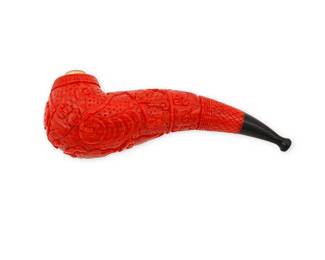 178
A Coral Pipe
Featuring a carved disc, cloud and winged animal motif

Measures: 5 3/8 x 1 1/2 in.
145.4 grams gross
Estimate: $1,800 - $2,200