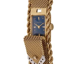 274
Brandt: A 14K Gold and Diamond Watch
Dial: 11.70 mm, rectangular teal dial with Diver hour markers
Case: 14.50 mm
Closure: with a woven gold bracelet flanked by gold rope chain of a buckle motif
Signed: dial

Inner circumference: 7 in.
54.7 grams gross
Estimate: $1,800 - $2,500
