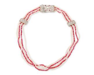 56
A Palladium, Ruby, Seed Pearl and Diamond Necklace
Featuring five strands of round ruby and seed pearl beads measuring approximately 2.40 - 2.60 mm, featuring two stations and a clasp set with rose-cut diamonds

Length: 16 in.
35.7 grams gross
Estimate: $1,500 - $2,500