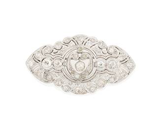248
A Platinum and Diamond Brooch
Of an ornate scalloped design featuring old mine-cut, old European-cut and single-cut diamonds weighing approximately 2.56 carats

Measures: 2 1/8 x 1 1/8 in.
16.7 grams gross
Estimate: $1,800 - $2,500