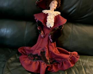 Antique Victorian porcelain doll with a case.