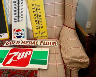 The sofa underneath the signs is available as well