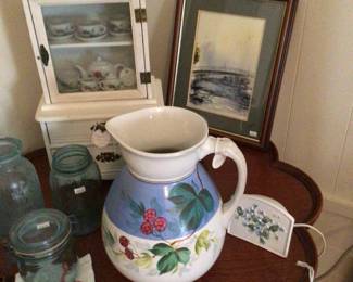 Child’s toy China cabinet with child’s tea set inside