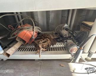 852 Milwaukee 12 Special Electric Drill, Remington Mall Saw, Chain Hoist, and Powerwinch