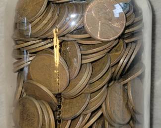 Jar filled with Wheat pennies.