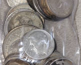100+ grams of US and Foreign coins containing silver.