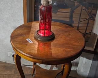 Cranberry lamp and round table 