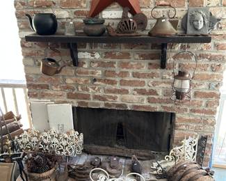 Copper kettles , old pulleys, iron flower bed fencing 