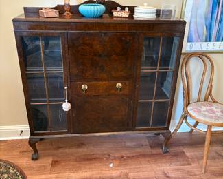 I am recycling a photo so a few of the things on top of this curio sold. The pink vase and the copper silent butler definitely sold.
