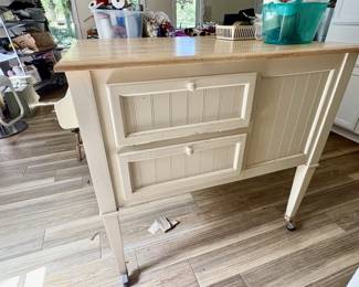 Tall crafting table on wheels.