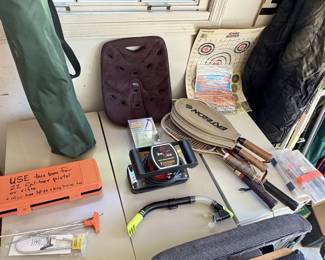 Sporting equipment. Includes a lot of scuba diving equipment.