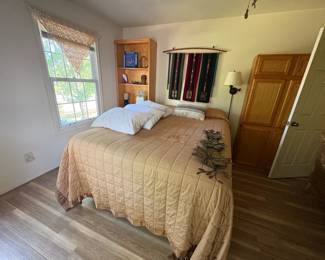 Queen bed and storage shelves
