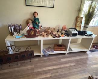 Unique dolls and play toys. Barbies. Storage shelf.