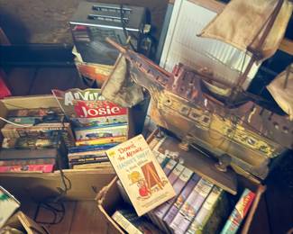 Vintage book sets, wooden sailboat
