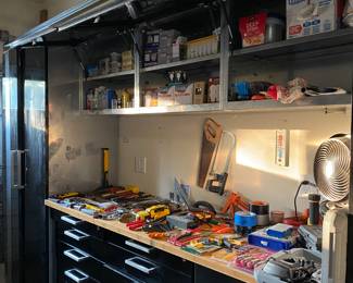 Nice garage storage system, two locking cabinets over head storage, work bench, tool drawers, bring sexy back to your garage