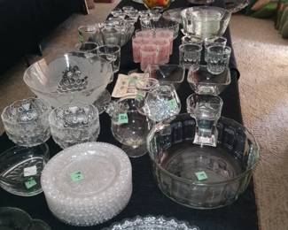 Lots of decorative serving pieces. Crystal bowls, candle sticks, glassware, and more