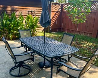 Patio table with 6 chairs. 2 are on the front porch