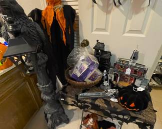 Large iron black raven on pedestal
