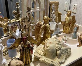 More angel collection. Notice antique cherub candlestick in background