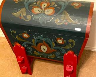 Decorative roll top, hand painted chest on stand.