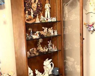 Vintage gun case converted into very nice curio cabinet. More rabbits.